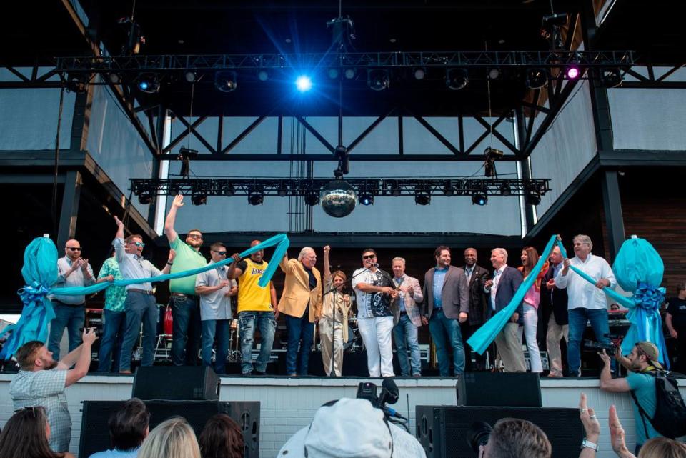 City leaders from several Coast communities help Gautier Mayor Casey Vaughn and Gautier City Manager Paula Yancy cut the ribbon before the inaugural show at The Sound Amphitheater in Gautier on Friday, April 12, 2024. Hannah Ruhoff/Sun Herald