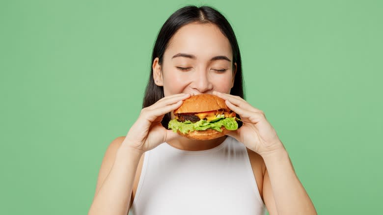 Person eating a burger