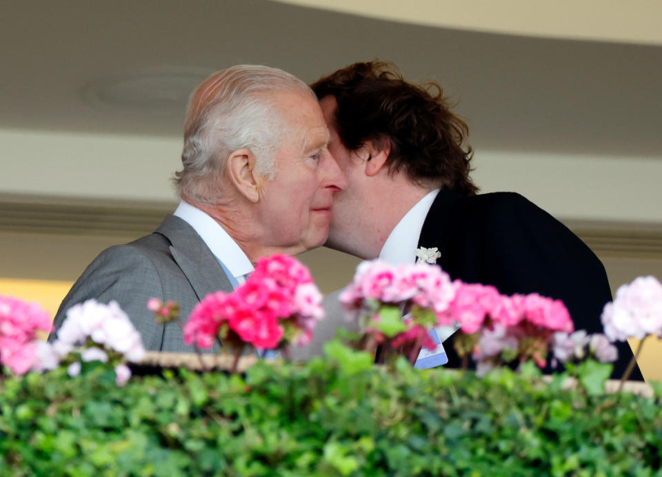 King Charles III kisses step-son Tom Parker Bowles as they watch the racing from the Royal Box on day three 'Ladies Day' of Royal Ascot 2024 at Ascot Racecourse on June 20, 2024 in Ascot, England. <p>Max Mumby/Indigo/Getty Images</p>