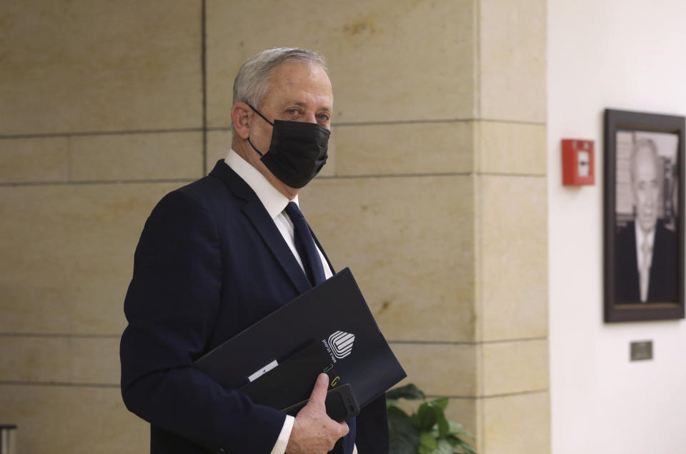 Israeli Defense Minister Benny Gantz arrives at the Israeli Knesset (Parliament) ahead of the vote on its dissolution, Wednesday, Dec. 2, 2020, in Jerusalem. Gantz announcing late Tuesday that his Blue & White Party will vote in favor of a bill to disperse the Knesset. (Alex Kolomoisky/Pool Photo via AP)