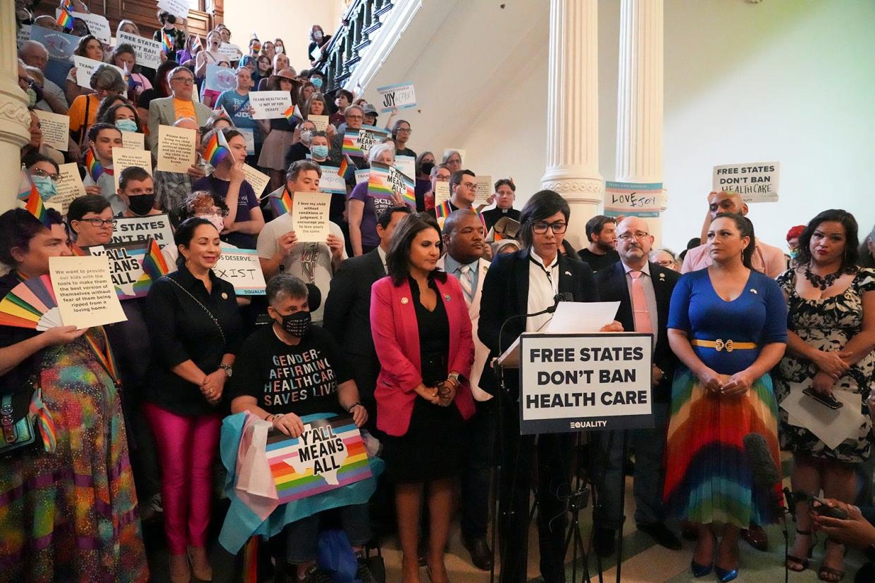 Some lawmakers stand alongside LGBTQ+ activists as they protest Senate Bill 14 at the Texas Capitol on May 12. SB 14 banned gender-affirming medical care for transgender children.