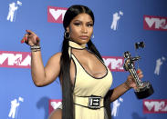 FILE - Nicki Minaj poses in the press room with her award for best hip-hop video for "Chun-Li" at the MTV Video Music Awards in New York on Aug. 20, 2018. Minaj will receive the Video Vanguard Award at the MTV Awards later this month. Minaj, who has won five MTV trophies for such hits as “Anaconda,” “Chun-Li” and “Hot Girl Summer,” will get the award and perform at the ceremony on Aug. 28 at the Prudential Center in Newark, N.J. (Photo by Evan Agostini/Invision/AP, File)