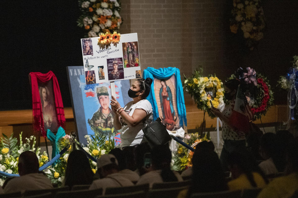 Rosa Samaniego holds a sign demanding justice for Spc. Vanessa Guillen at a memorial service in honor of the soldier on Friday, Aug. 14, 2020, in Houston. Guillen, who was last seen on April 22, was laid to rest nearly four months after she is said to have been killed by a fellow soldier at Fort Hood, a U.S. Army base in Texas. Mourners gathered at Cesar Chavez High School in Houston, where Guillen grew up playing soccer and dreaming of joining the military. (Marie D. De Jesus/Houston Chronicle via AP, Pool)