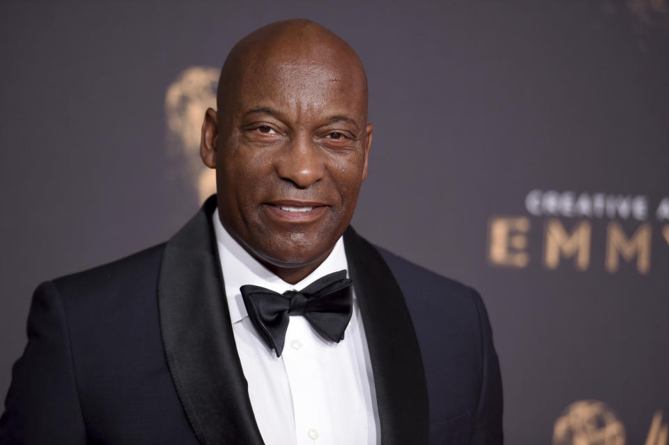 Director John Singleton arrives at the Creative Arts Emmy Awards in Los Angeles on Sept. 9, 2017. A director who made one of Hollywood's most memorable debuts with the Oscar-nominated "Boyz N the Hood" died April 29 after suffering a stroke. He was 51. (Photo by Richard Shotwell/Invision/AP)