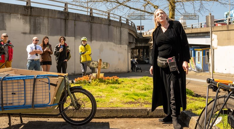 The mother of David Bentley, Theresa Fletcher, speaks at the installation of a ghost bike at the spot where he died in a hit-and-run, March 30, 2024 (Sarah Risser)