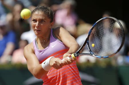 Sara Errani of Italy returns the ball to Serena Williams of the U.S. during their women's quarter-final match during the French Open tennis tournament at the Roland Garros stadium in Paris, France, June 3, 2015. REUTERS/Vincent Kessler