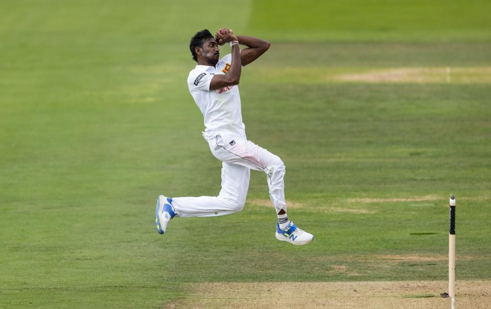 Milan Rathnayake charges in to bowl.