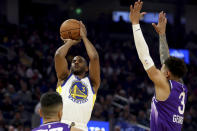 Golden State Warriors guard Chris Paul, top left, looks to shoot against Utah Jazz guard Keyonte George, right, during the first half of an NBA basketball game in San Francisco, Sunday, April 14, 2024. (AP Photo/Jed Jacobsohn)