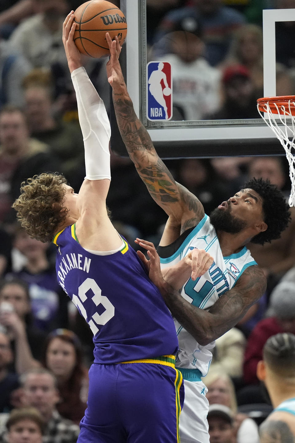 Charlotte Hornets center Nick Richards (4) blocks Utah Jazz forward Lauri Markkanen (23) during the second half of an NBA basketball game Thursday, Feb. 22, 2024, in Salt Lake City. (AP Photo/Rick Bowmer)