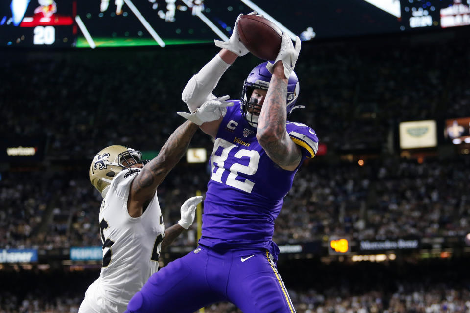 Minnesota Vikings tight end Kyle Rudolph (82) pulls in the game winning touchdown pass over New Orleans Saints cornerback P.J. Williams (26) during overtime of an NFL wild-card playoff football game, Sunday, Jan. 5, 2020, in New Orleans. The Vikings won 26-20. (AP Photo/Brett Duke)