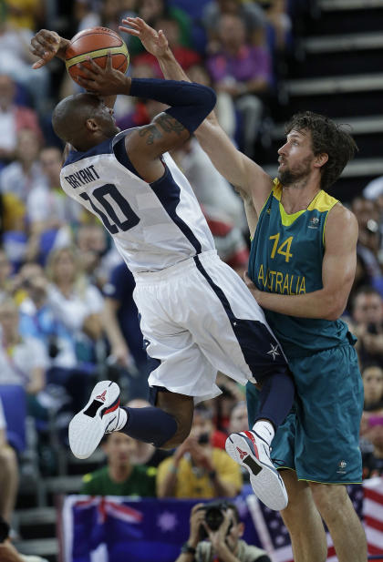 Kobe Bryant (10) puts up a shot as Australia's Matt Nielsen (14) defends on Wednesday. (AP)