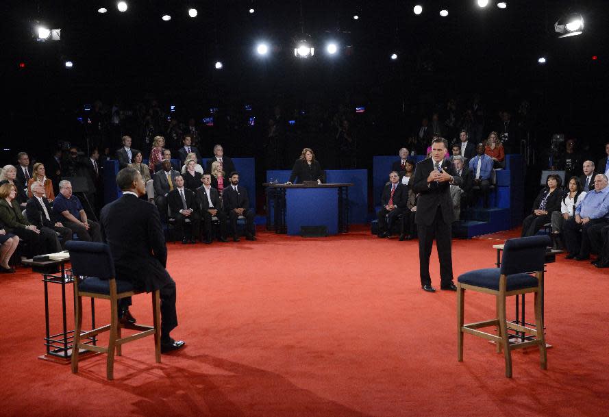 President Barack Obama, left, listens to Republican presidential nominee Mitt Romney during the second presidential debate at Hofstra University, Tuesday, Oct. 16, 2012, in Hempstead, N.Y. (AP Photo/Pool-Michael Reynolds)