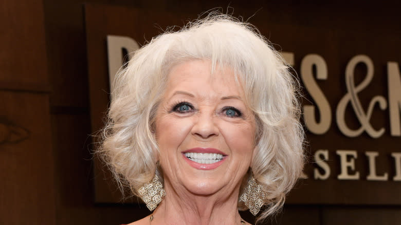 paula deen grinning proudly