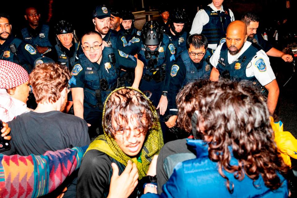 PHOTO:Demonstrators clash with the Metropolitan Police Department officers at George Washington University in Washington, DC, May 8, 2024. (Sage Russell/AP)