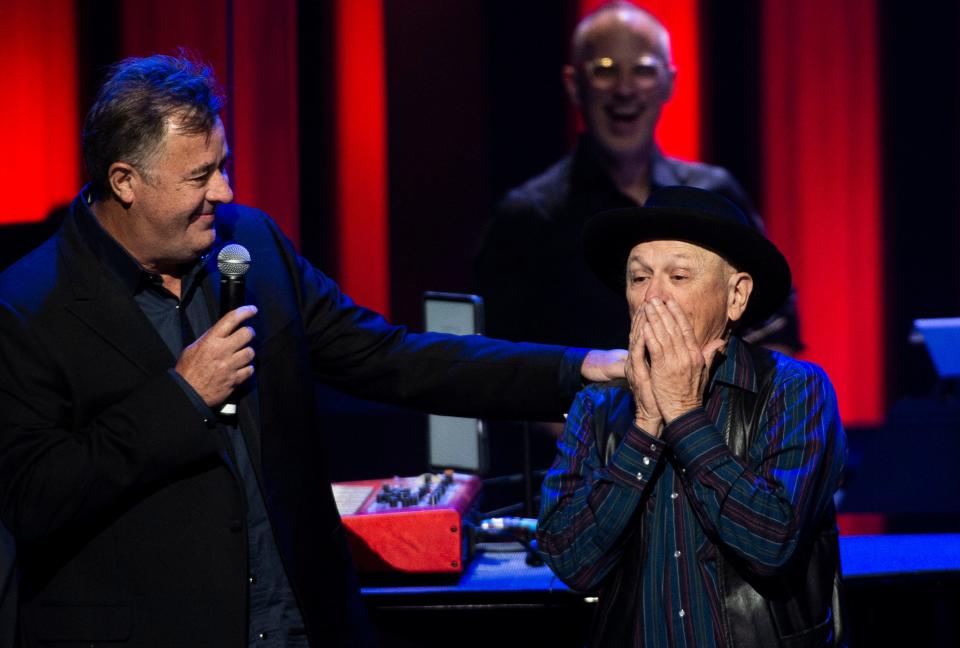 Charlie McCoy reacts after being invited to become a member of the Grand Ole Opry at Grand Ole Opry House in Nashville , Tenn., Saturday, June 11, 2022.
