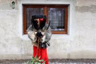 A reveller dressed as devil is seen in the village of Valasska Polanka