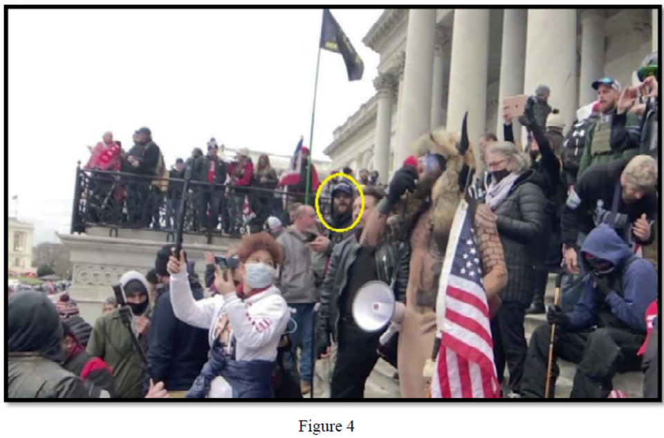 Taylor Taranto is seen near the Qanon Shaman on the steps outside of the U.S. Capitol on Jan. 6, 2021, in this image included in court documents.