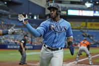 Tampa Bay Rays' Yandy Diaz celebrates after scoring on an RBI single by Manuel Margot against the Baltimore Orioles during the first inning of a baseball game Saturday, June 12, 2021, in St. Petersburg, Fla. (AP Photo/Chris O'Meara)