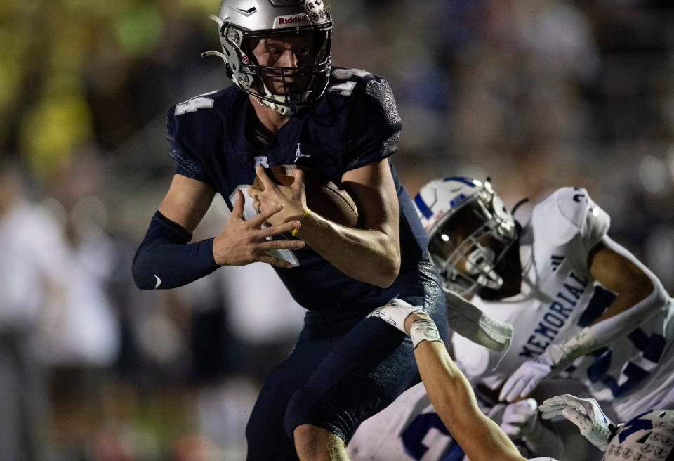Reitz’s Ben Davies (14) eyes the end zone as the Reitz Panthers play the Memorial Tigers at the Reitz Bowl in Evansville, Ind., Friday Sept. 29, 2023.