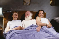 Actors (L-R) Nicholas Lyndhurst, Buster Merryfield and David Jason pictured in bed together during the filming of episode 'The Class of '62' of the BBC Television sitcom 'Only Fools and Horses', December 20th 1990. (Photo by Don Smith/Radio Times/Getty Images)