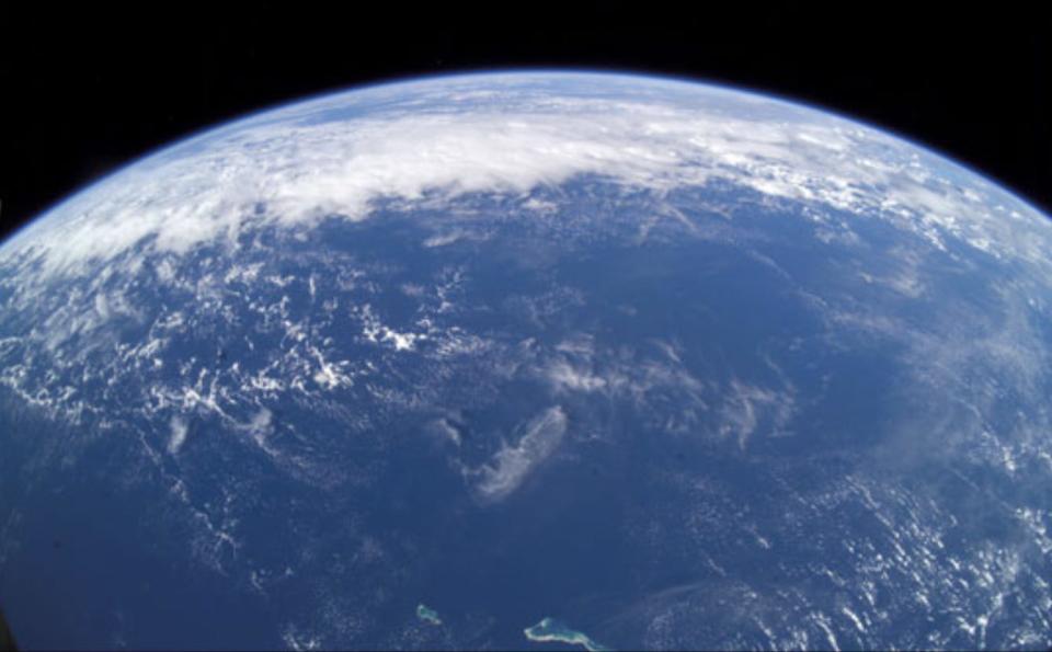 Taken June 13, 2003 by astronaut Ed Yu, this is the broadest view of Earth that an astronaut can get from the International Space Station. Ed took this view of the “Big Blue Beach Ball” using a wide angle lens while the Station was over the Pacific Ocean. In the foreground are the atolls of Tabitueua and Onotoa.