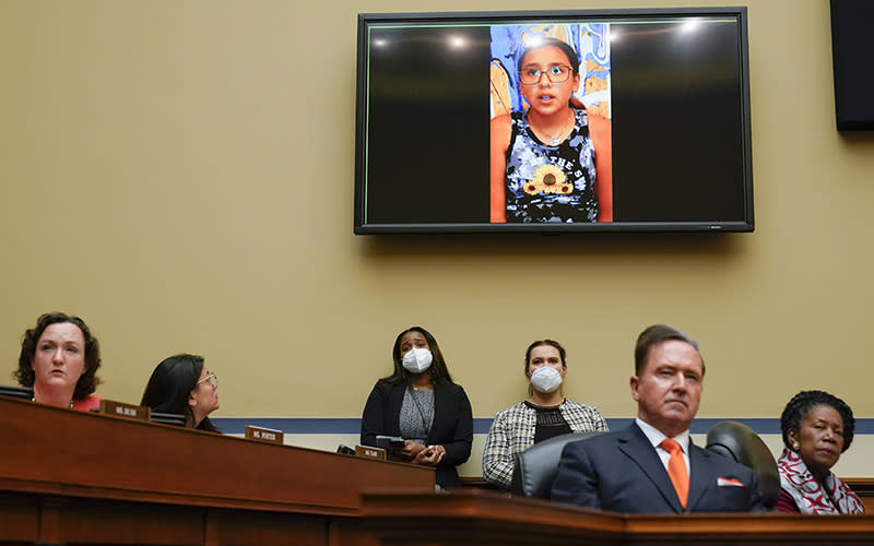 Miah Cerrillo appears on a screen above House members as a hearing on gun violence takes place