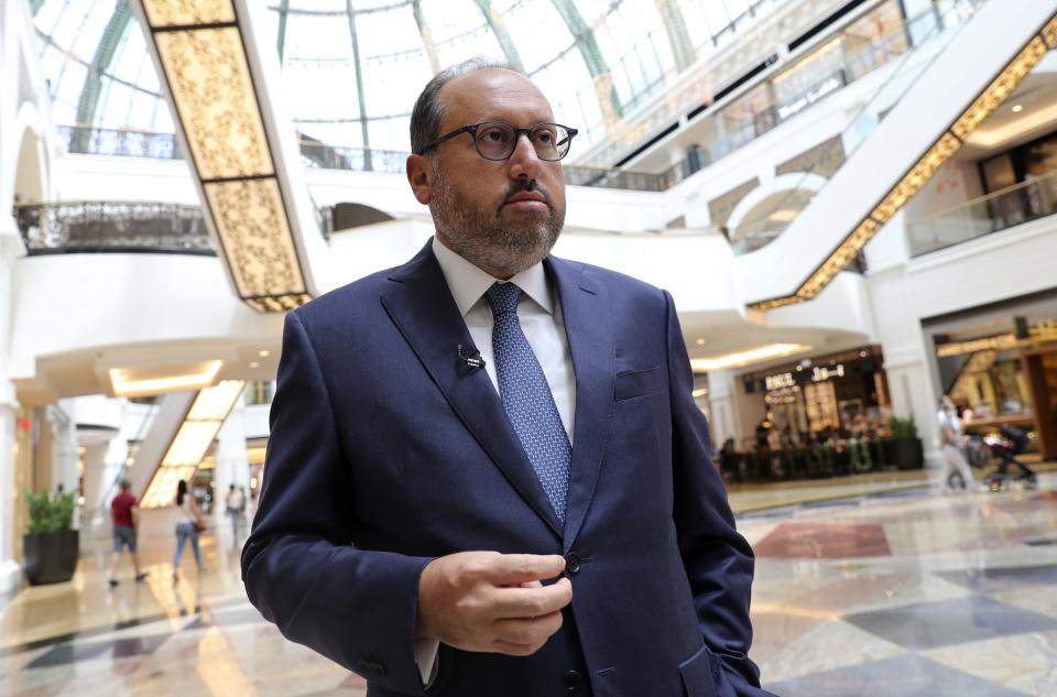 Alain Bejjani, CEO of the Majid Al Futtaim Group, talks to The Associated Press at the Mall of the Emirates in Dubai, United Arab Emirates, Thursday, April 15, 2021. The Middle East's largest operator of malls, Majid Al Futtaim, expects revenue and earnings to climb back to pre-pandemic levels by the end of next year and is moving full steam ahead with plans to develop its biggest mall ever. (AP Photo/Kamran Jebreili)