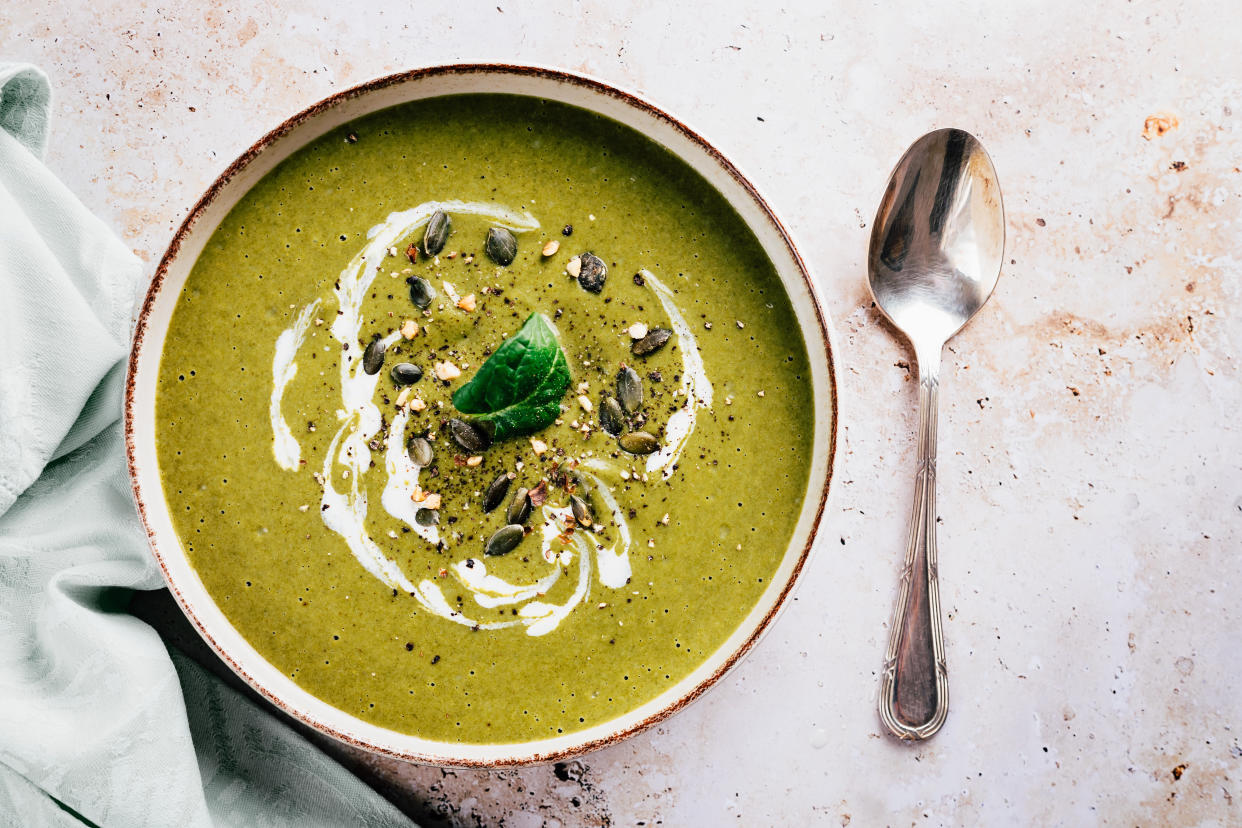 Flat lay of soup made with green vegetables and cream