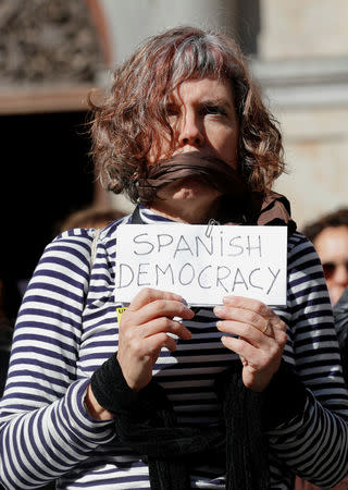 A woman protests against Supreme Court at Sant Jaume square in Barcelona, Spain February 12, 2019. REUTERS/Albert Gea