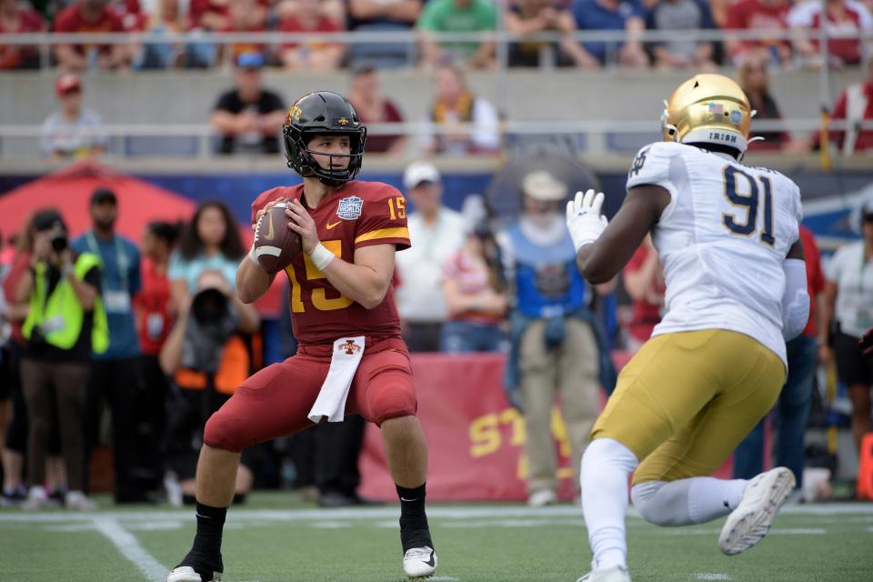 Iowa State quarterback Brock Purdy sets up to throw a pass in front of Notre Dame defensive lineman Adetokunbo Ogundeji during the first half of the Camping World Bowl Game, Saturday, Dec. 28, 2019, in Orlando.