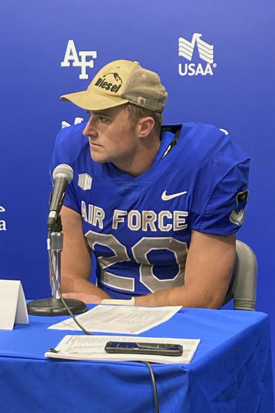 Air Force NCAA college football fullback Brad Roberts speaks during a press conference at Air Force Academy, Colo., Sept. 10, 2022. The offensive linemen for Air Force call themselves “Diesel,” a nickname invented a few seasons ago to personify the grit and toughness they use to help power the Falcons. All starting offensive linemen are inducted. But there can also be honorary “Diesel,” members, those who demonstrate the qualities of being a lineman. Like fullback Brad Roberts, who earned a hat last season. (AP Photo/Pat Graham)