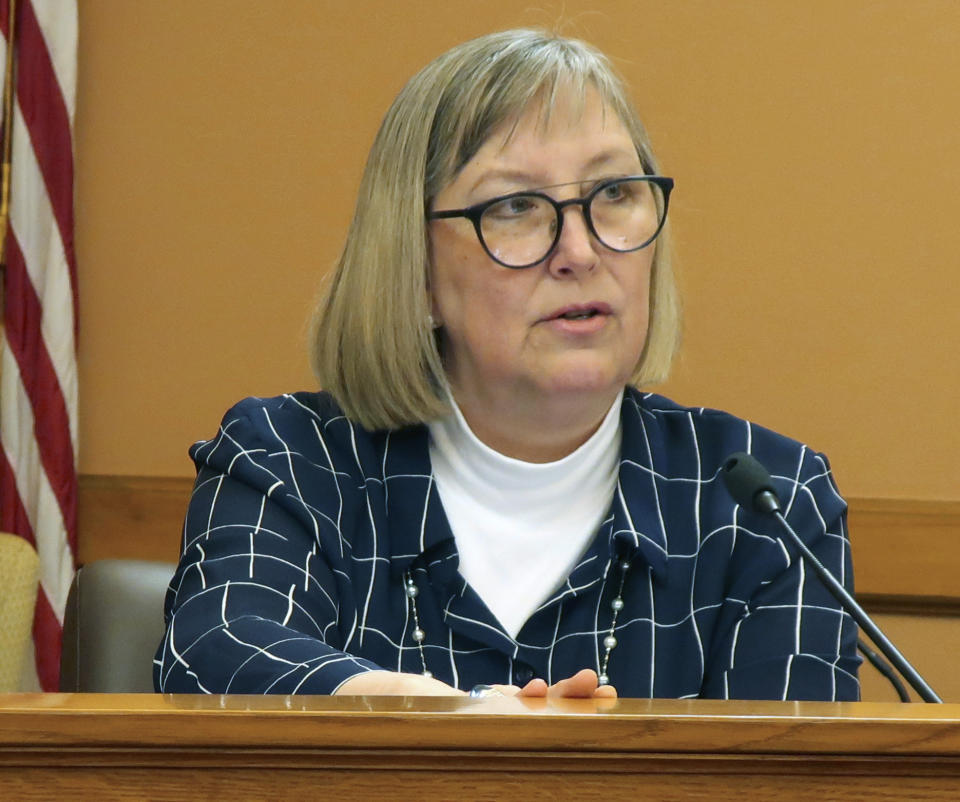Kansas state Sen. Molly Baumgardner, R-Louisburg, discusses a bill containing Democratic Gov. Laura Kelly's proposal to boost public school funding during a meeting of fellow GOP senators, Thursday, April 4, 2019, at the Statehouse in Topeka, Kansas. Baumgardner is the chairwoman of a Senate committee on school funding and helped draft the final version of the bill. (AP Photo/John Hanna)