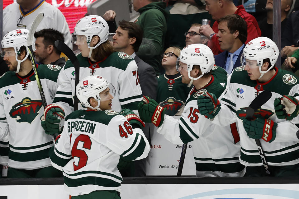 Minnesota Wild defenseman Jared Spurgeon (46) is congratulated after his goal agains the San Jose Sharks during the first period of an NHL hockey game in San Jose, Calif., Saturday, March 11, 2023. (AP Photo/Josie Lepe)
