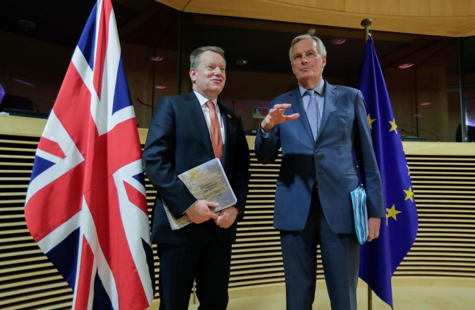 European Union chief Brexit negotiator Michel Barnier (R) and the British Prime Minister's Europe adviser David Frost speak at start of the first round of post-Brexit trade deal talks between the EU and the United Kingdom, in Brussels on March 2, 2020. (Photo by Olivier HOSLET / POOL / AFP) (Photo by OLIVIER HOSLET/POOL/AFP via Getty Images)