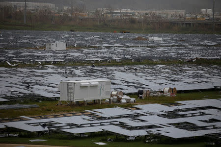 FILE PHOTO: Damaged solar panels are seen after the area was hit by Hurricane Maria in Humacao, Puerto Rico on September 22, 2017. REUTERS/Carlos Garcia Rawlins/File Photo