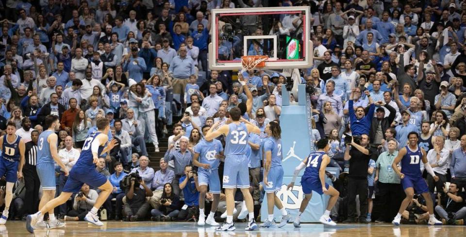 Duke’s Wendell Moore Jr. (0), right, reacts as his tip of a missed shot by Tre Jones (3) drops into the basket as time expires to give Duke a 98-96 overtime victory over North Carolina on Saturday, February 8, 2020 at the Smith Center in Chapel Hill, N.C.