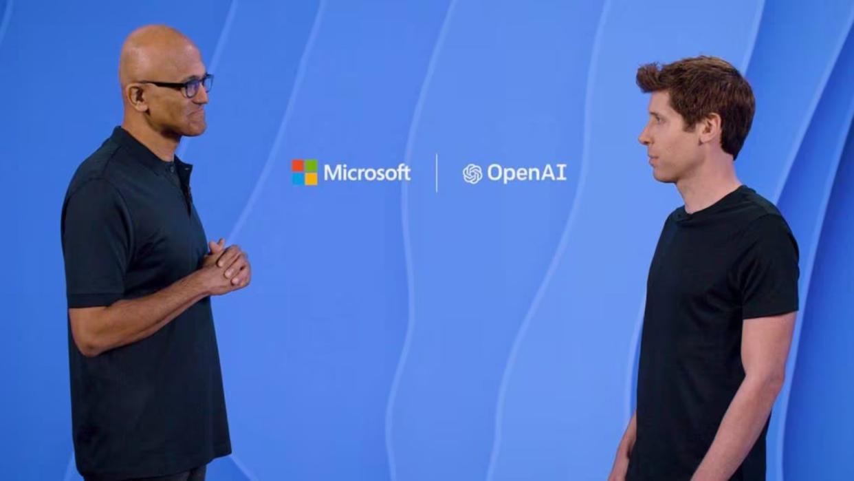  Satya Nadella with Sam Altman at a conference. 