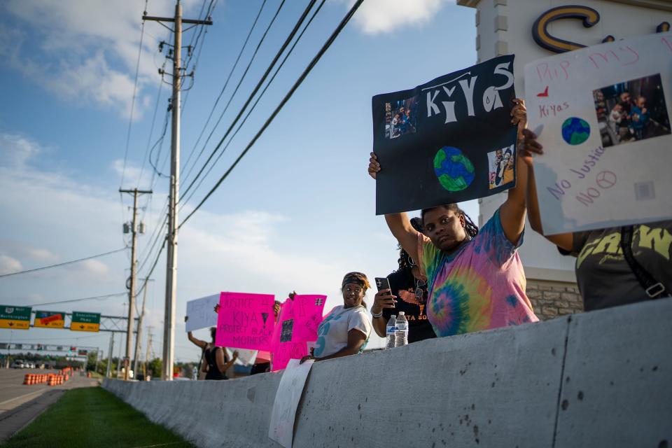 Aug 25, 2023; Columbus, OH, USA; Friends, family and activists gathered to protest the shooting of 21-year-old Ta'Kiya Young, who was shot and killed by Blendon Twp. police outside the Sunbury Road Kroger on Thursday. Ta'Kiya was pregnant with a girl and due in November, according to family.