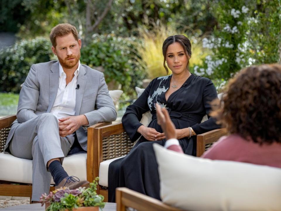 Prince Harry and Meghan Markle being interviewed by Oprah Winfrey. VIA REUTERS
