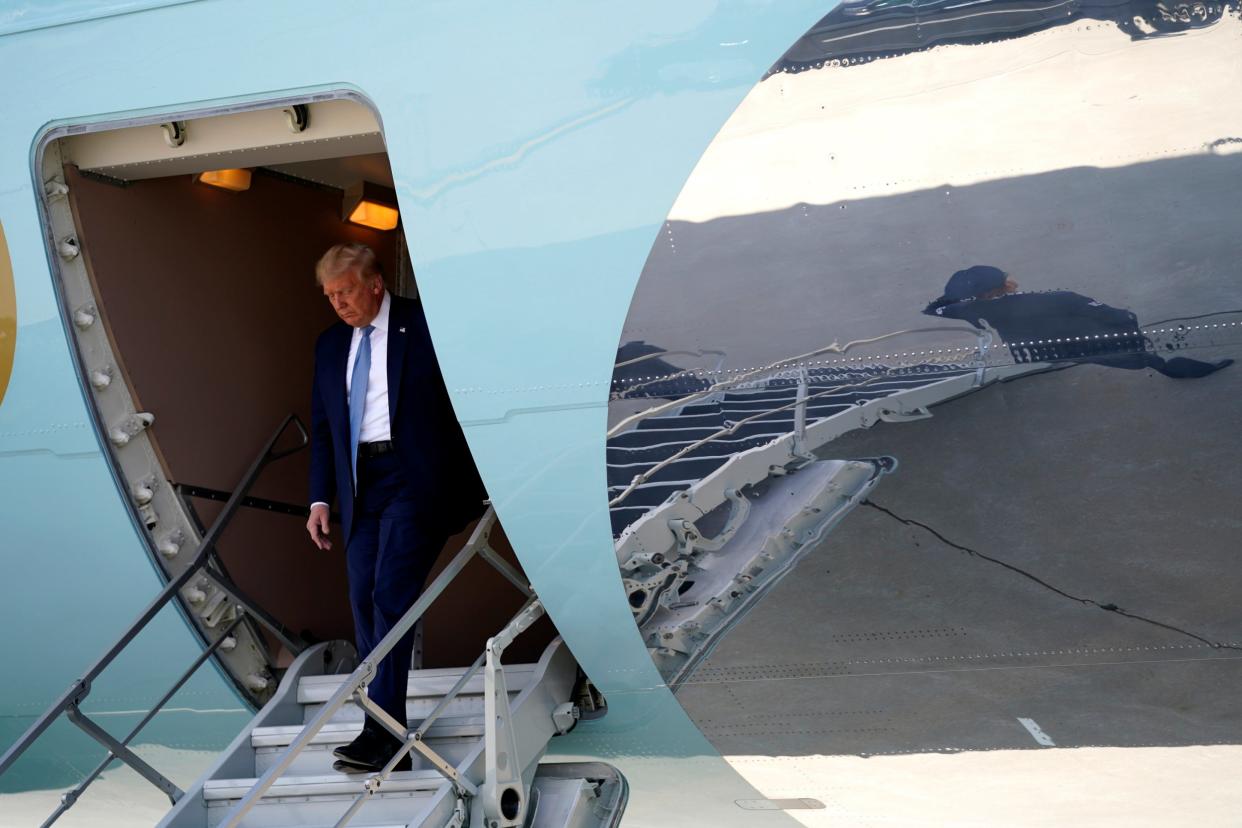 Donald Trump steps off of Air Force One as he arrives at the Eastern Iowa Airport for a briefing on derecho damage on 18 August, 2020: AP