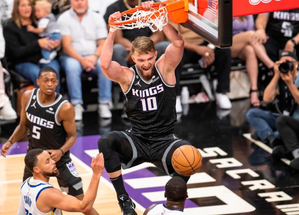 Sacramento Kings center Domantas Sabonis (10) dunks the ball during the first half against the Golden State Warriors during the first half of Game 1 of the first-round NBA basketball playoff series at Golden 1 Center on Saturday, April 15, 2023.