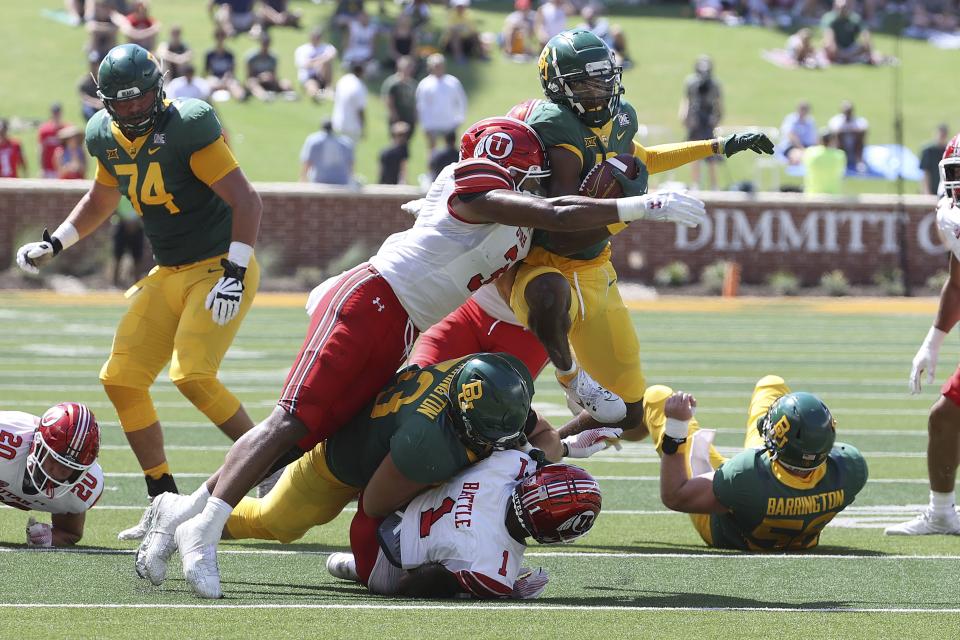 Baylor wide receiver Hal Presley (16) is tackled Utah linebacker Levani Damuni (3) in the first half of an NCAA college football game, Saturday, Sept. 9, 2023, in Waco, Texas. (AP Photo/Jerry Larson) | AP