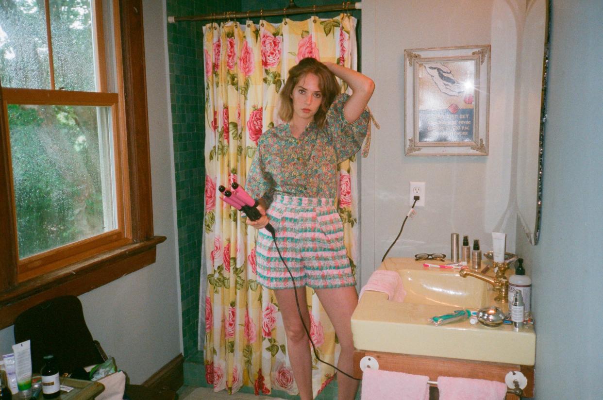Maya Hawke wears a Liberty floral-print blouse and tweed shorts from Zac Posen’s SS19 collection. (Photo: Courtesy of Zac Posen)
