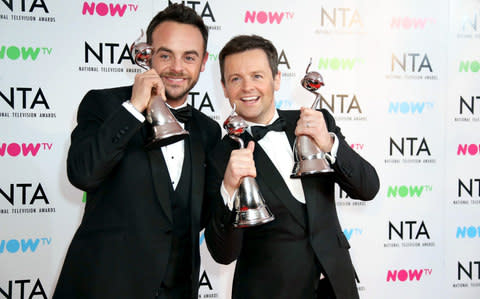 Anthony McPartlin and Declan Donnelly pose in the press room with the The Bruce Forsyth Entertainment Award and TV Presenter Award  - Credit: Wireimage