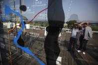 Visitors look at a map showing the demilitarized zone separating the two Koreas at Imjingak pavilion near the truce village of Panmunjom in Paju, north of Seoul June 10, 2013. REUTERS/Kim Hong-Ji/Files