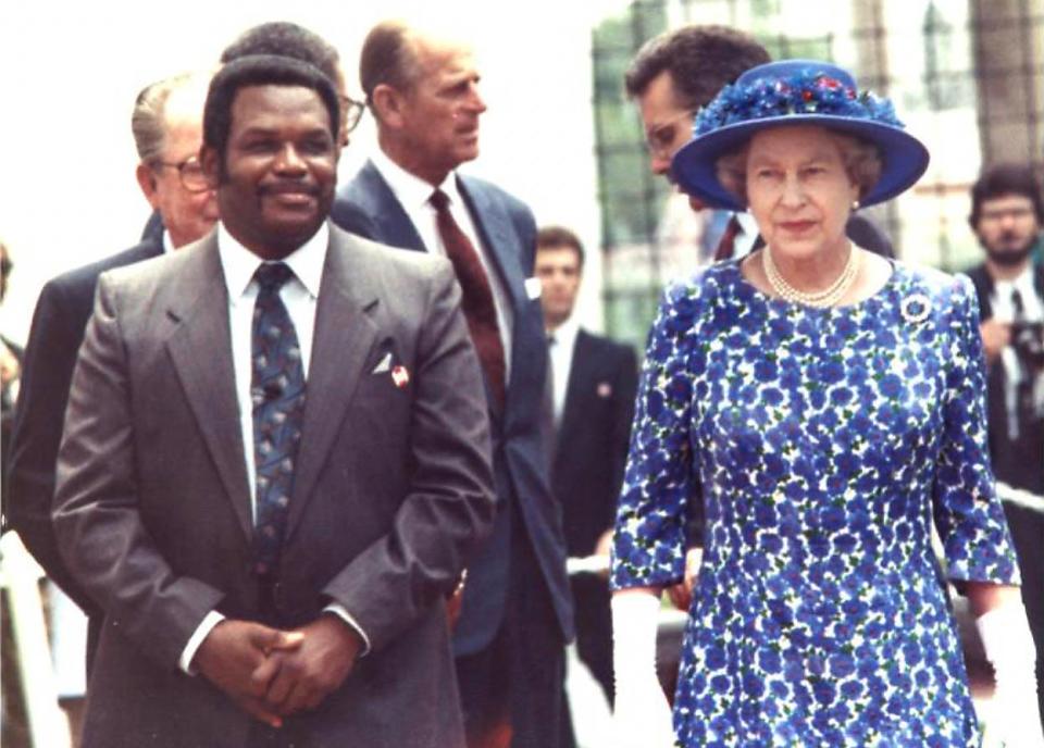 John Williams, the former principal of Booker T. Washington Middle School with Queen Elizabeth II in this photo from 1991 in Miami, Florida.