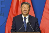 FILE - Chinese President Xi Jinping speaks during his joint press conference with Hungarian Prime Minister Viktor Orban following their talks at the PM's office, the former Carmelite Monastery, in Budapest, Hungary, Thursday, May 9 2024. Most countries in the European Union are making efforts to “de-risk” their economies from perceived threats posed by China. But Hungary and Serbia have gone in the other direction. They are courting major Chinese investments in the belief that the world’s second-largest economy is essential for Europe’s future. (Szilard Koszticsak/MTI via AP, File)