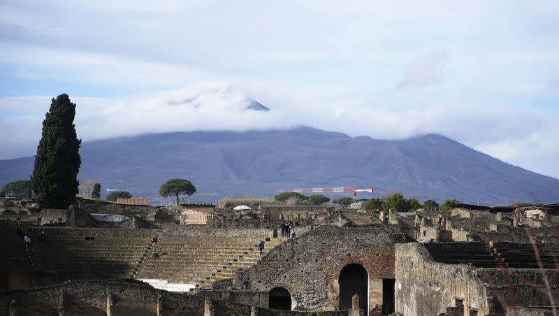 The Mount Vesuvius volcano towers over the remains of the ancient town of Pompeii in southern Italy on Feb. 15, 2022.