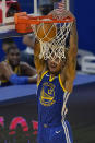 Golden State Warriors guard Kelly Oubre Jr. (12) dunks against the Charlotte Hornets during the first half of an NBA basketball game in San Francisco, Friday, Feb. 26, 2021. (AP Photo/Jeff Chiu)
