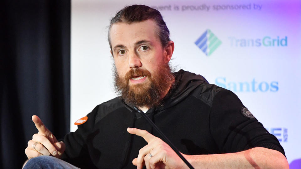 Atlassian co-founder and tech billionaire Mike Cannon-Brookes is seen here giving a speech.